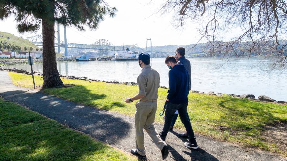 Cadets walking at waterfront on campus