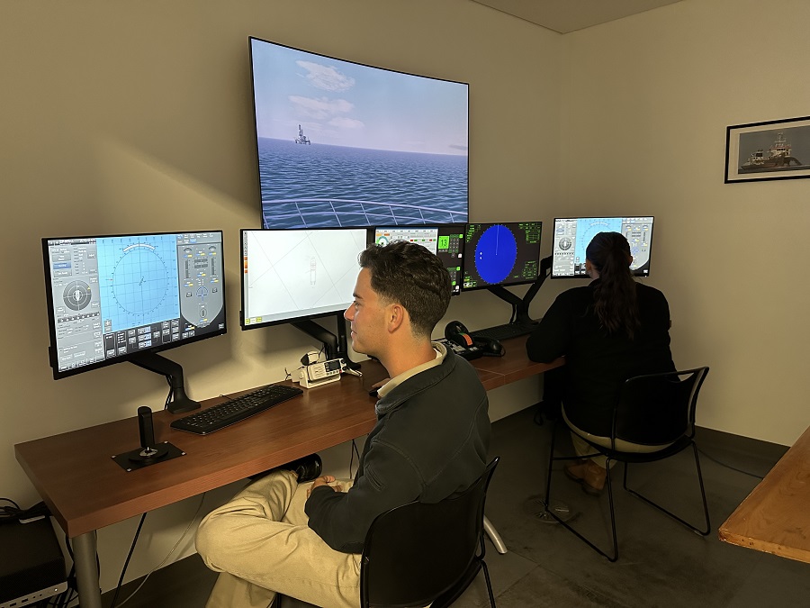 students in dynamic positioning program working on computers